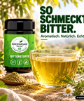 ANCENASAN® 49 Bitterkräuter-Teepulver – Dose mit Tasse Tee und Kamille